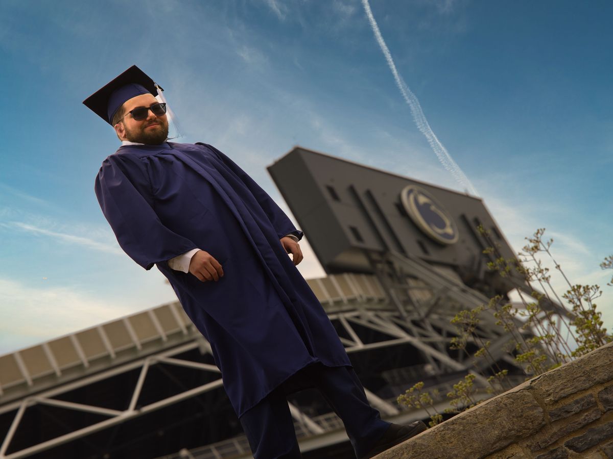Graduate on the wall in front of Beaver Stadium