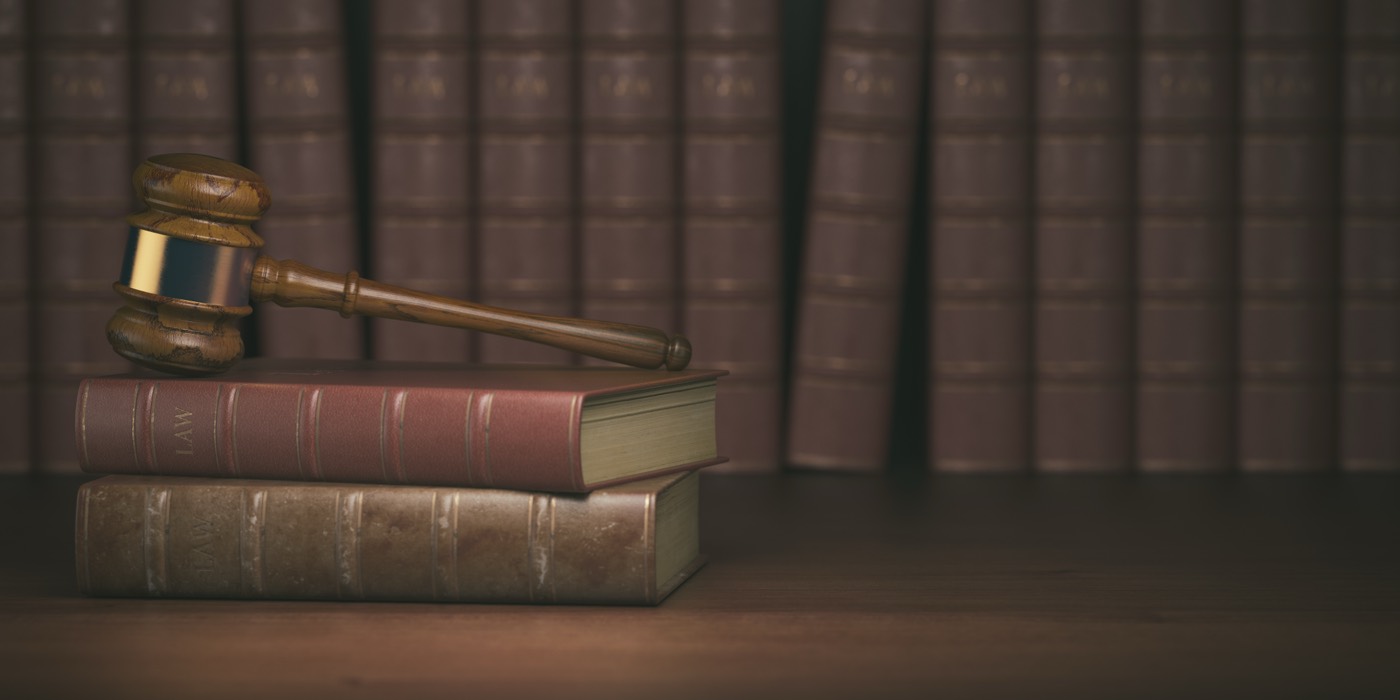 Gavel resting on vintage law books